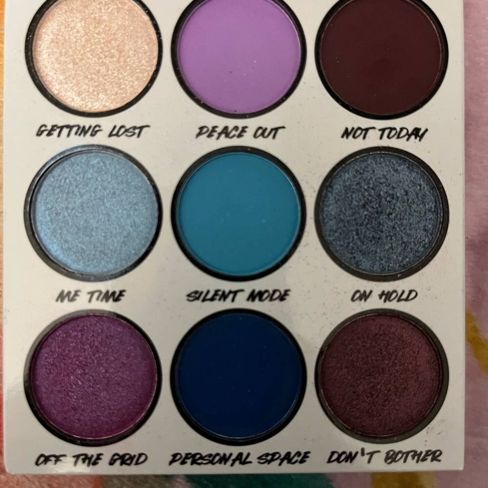 Gold and Purple Eyeshadow Palette with Shimmer and Matte Finishes